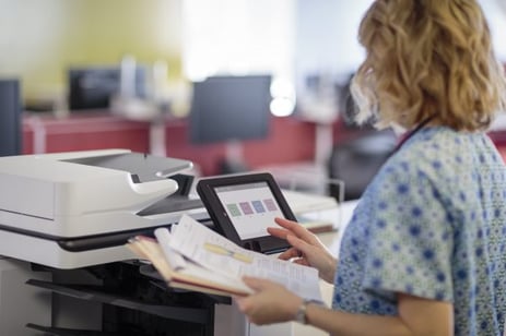 nurse using an hp mfp in an optimized healthcare print environment