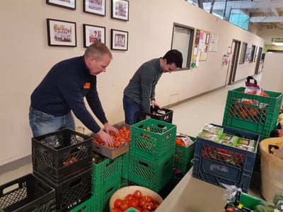 smartprint employees helping sort food items at daily bread