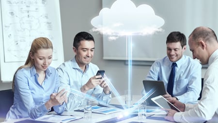 A team of co-workers using document processing services through cloud connectivity. 